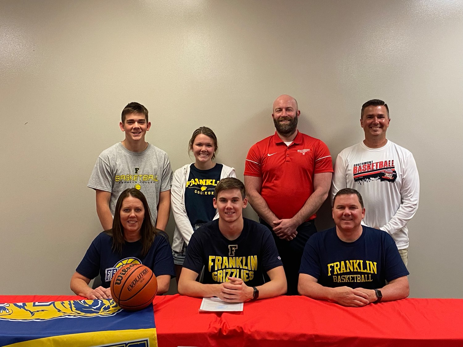 Southmont’s Logan Oppy is pictured with his family and Southmont basketball head coach Jake Turner and assistant coach Dan Chadd.